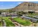 Aerial view of resort with pool, golf course, and mountain backdrop at 5008 N Ascent Dr, Scottsdale, AZ 85251