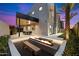 Modern backyard with fire pit, dining area, and mountain views at 5008 N Ascent Dr, Scottsdale, AZ 85251