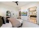 Spacious bedroom with king bed, ensuite bathroom and large mirrors at 5008 N Ascent Dr, Scottsdale, AZ 85251