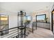 Modern glass elevator and upper level landing with city views at 5008 N Ascent Dr, Scottsdale, AZ 85251