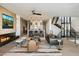 Modern living room with a linear fireplace and city views at 5008 N Ascent Dr, Scottsdale, AZ 85251
