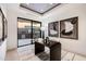 Home office with private access to backyard patio and modern desk at 5008 N Ascent Dr, Scottsdale, AZ 85251