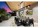Outdoor kitchen with grill, dining area, and modern appliances at 5008 N Ascent Dr, Scottsdale, AZ 85251