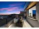 Rooftop terrace with seating and fireplace, offering sunset views at 5008 N Ascent Dr, Scottsdale, AZ 85251