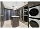 Spacious walk-in closet with ample shelving and built-in washer and dryer at 5008 N Ascent Dr, Scottsdale, AZ 85251