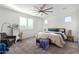 Spacious bedroom with carpeted floor and ceiling fan at 5203 W Roundhouse Rd, Laveen, AZ 85339