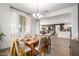 Open concept dining room with views into the kitchen and living room at 5203 W Roundhouse Rd, Laveen, AZ 85339