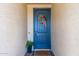 Blue front door with a fall-themed wreath at 5203 W Roundhouse Rd, Laveen, AZ 85339