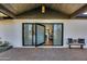 Modern front entrance with pivot glass door and brick columns at 8701 E Highland Ave, Scottsdale, AZ 85251