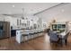 Spacious kitchen with island, white cabinets, and stainless steel appliances at 8701 E Highland Ave, Scottsdale, AZ 85251