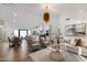 Open living room with stylish furniture and view of kitchen and dining area at 8701 E Highland Ave, Scottsdale, AZ 85251
