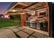 Luxury outdoor kitchen with grill and bar at 8701 E Highland Ave, Scottsdale, AZ 85251