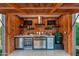 Luxury outdoor kitchen with stainless steel appliances at 8701 E Highland Ave, Scottsdale, AZ 85251