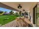 Covered patio with seating area and lawn view at 8701 E Highland Ave, Scottsdale, AZ 85251