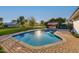 Inviting swimming pool with brick pavers and outdoor kitchen at 8701 E Highland Ave, Scottsdale, AZ 85251