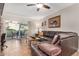 Cozy living room with leather sectional sofa and access to patio at 9450 E Becker Ln # 1094, Scottsdale, AZ 85260