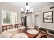 Bright dining room with a wood table and chairs at 9450 E Becker Ln # 1094, Scottsdale, AZ 85260