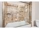 Bathroom with a tub and shower, updated tile, and a glass enclosure at 9450 E Becker Ln # 1094, Scottsdale, AZ 85260