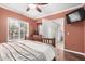 Bedroom with a queen-size bed and access to a patio at 9450 E Becker Ln # 1094, Scottsdale, AZ 85260