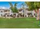 Building exterior showcasing a two-story condo building with landscaping at 9450 E Becker Ln # 1094, Scottsdale, AZ 85260