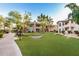 Condo community with grassy areas, walkways, and mature trees at 9450 E Becker Ln # 1094, Scottsdale, AZ 85260