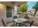 Private patio with a table and chairs, perfect for outdoor dining at 9450 E Becker Ln # 1094, Scottsdale, AZ 85260