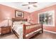 Bedroom with dark wood furniture and tile floors at 9450 E Becker Ln # 1094, Scottsdale, AZ 85260