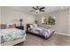 Bedroom with two twin beds and wood flooring at 9913 W Pleasant Valley Rd, Sun City, AZ 85351