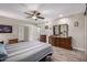 Comfortable bedroom with wood-look floors and ceiling fan at 9913 W Pleasant Valley Rd, Sun City, AZ 85351