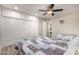 Bedroom with queen bed, built-in closet and ceiling fan at 9913 W Pleasant Valley Rd, Sun City, AZ 85351