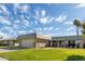 Ranch-style home with a large grassy yard and attached garage at 9913 W Pleasant Valley Rd, Sun City, AZ 85351
