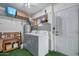 Laundry room with washer, dryer, and storage shelves at 9913 W Pleasant Valley Rd, Sun City, AZ 85351