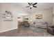 Open living room featuring hardwood floors and neutral color palette at 9913 W Pleasant Valley Rd, Sun City, AZ 85351