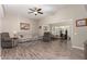 Spacious living area with hardwood floors and access to backyard at 9913 W Pleasant Valley Rd, Sun City, AZ 85351