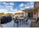 Covered patio with seating area and grill at 9913 W Pleasant Valley Rd, Sun City, AZ 85351