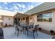 Covered patio with seating area and grill at 9913 W Pleasant Valley Rd, Sun City, AZ 85351