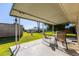 Covered patio with seating area and view of backyard at 9913 W Pleasant Valley Rd, Sun City, AZ 85351