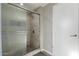 Shower with glass enclosure and tile surround at 9913 W Pleasant Valley Rd, Sun City, AZ 85351