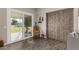 Bright sunroom with sliding glass doors leading to the backyard at 9913 W Pleasant Valley Rd, Sun City, AZ 85351