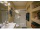 Bathroom boasts a large shower, modern vanity, and built-in shelving at 26702 N 97Th Ln, Peoria, AZ 85383