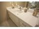 Bathroom boasts a modern vanity with white countertop and a vessel sink at 26702 N 97Th Ln, Peoria, AZ 85383