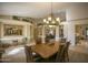 Elegant dining room with chandelier, and large windows at 26702 N 97Th Ln, Peoria, AZ 85383