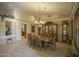 Formal dining room with wood table and chairs, and a chandelier at 26702 N 97Th Ln, Peoria, AZ 85383