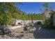 Outdoor fire pit and seating area in a paved backyard at 26702 N 97Th Ln, Peoria, AZ 85383