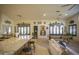 Open floor plan with pool table, kitchen island, and seating area at 26702 N 97Th Ln, Peoria, AZ 85383
