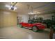 Large garage with overhead storage and room for multiple vehicles at 26702 N 97Th Ln, Peoria, AZ 85383