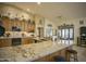 Large kitchen with granite countertops and ample cabinetry at 26702 N 97Th Ln, Peoria, AZ 85383