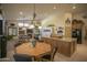 Open concept kitchen with island, breakfast nook, and pool table view at 26702 N 97Th Ln, Peoria, AZ 85383