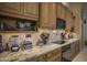 Modern kitchen with granite countertops and stainless steel appliances at 26702 N 97Th Ln, Peoria, AZ 85383