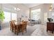 Bright dining area with hardwood table and chairs, adjacent to living room at 31013 N 41St Pl, Cave Creek, AZ 85331